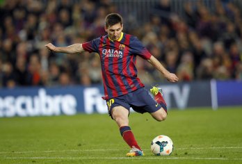 Download Lionel Messi Kicking A Ball Wallpaper | Wallpapers.com
