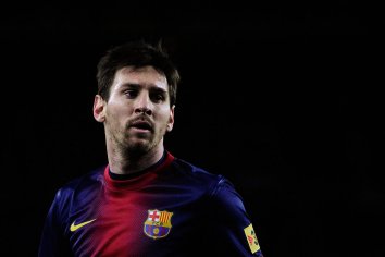 Download Lionel Messi Black Backdrop Wallpaper | Wallpapers.com