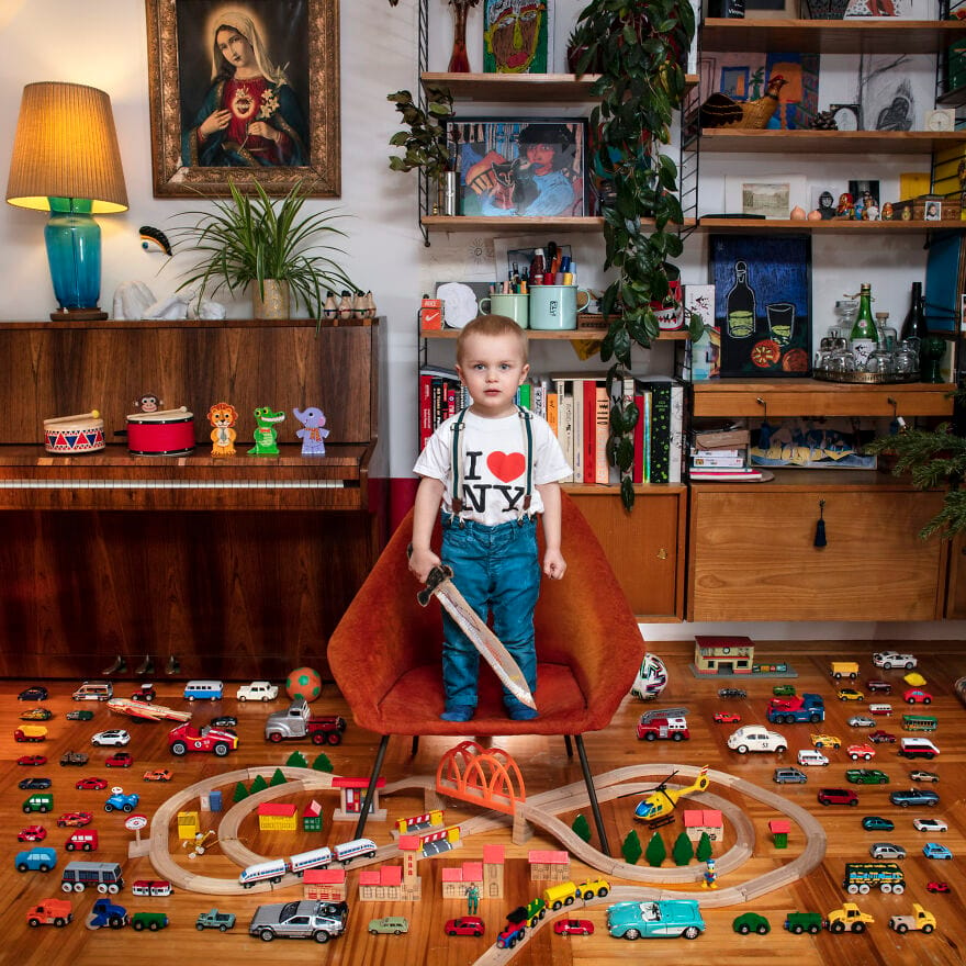 Young boy with sword and toy car