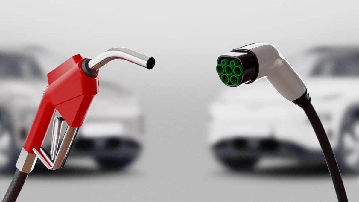 Gas nozzle next to electric car charger