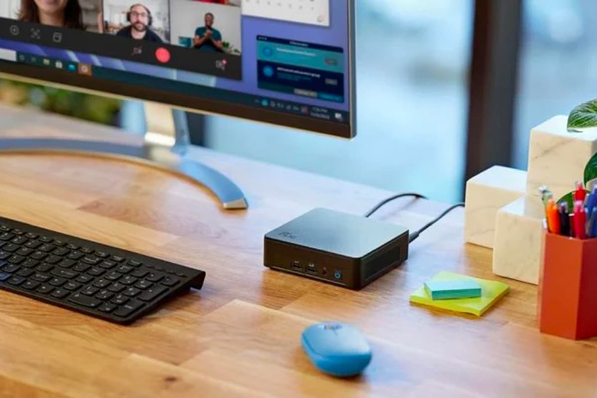 Intel NUC 13 Pro computer on the desk next to the keyboard