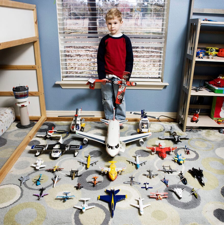 Boy with toy airplanes