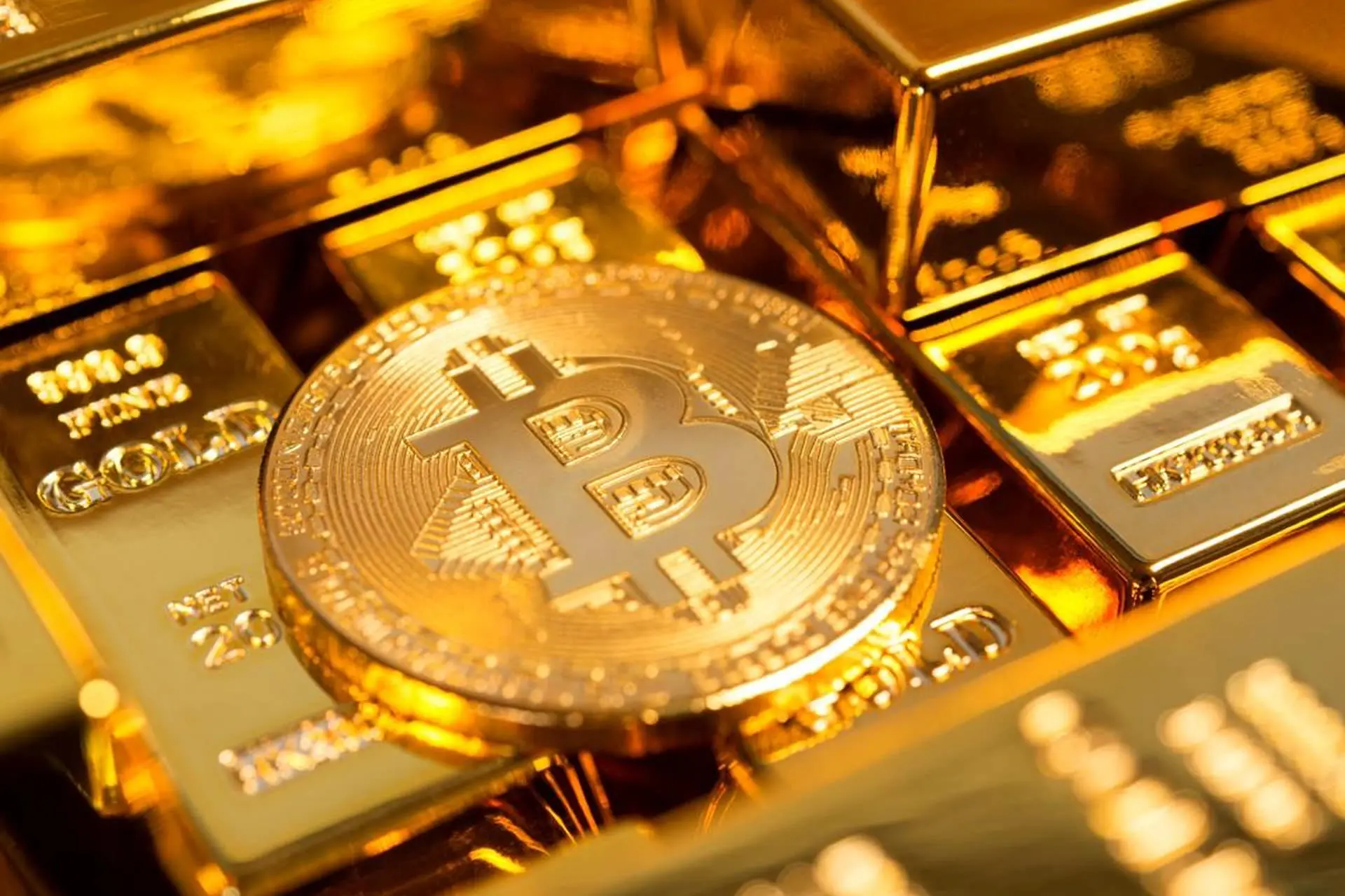 Bitcoin coin / Bitcoin / Bitcoin next to gold bars