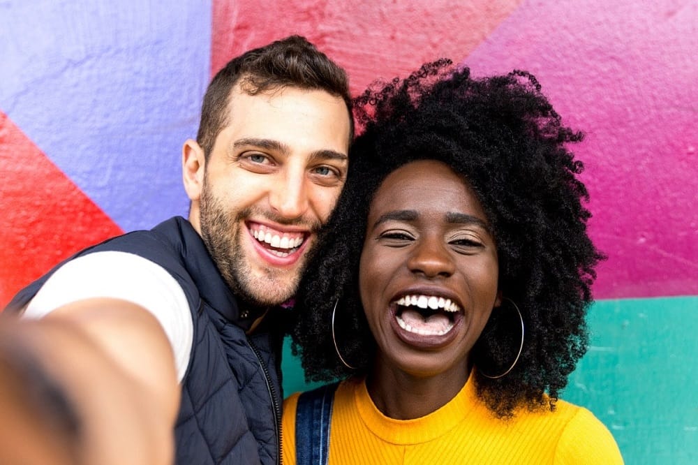 Man and woman smiling for a selfie