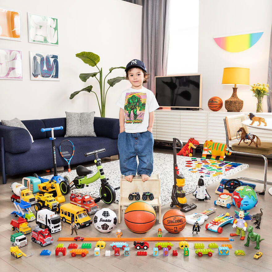 A little girl with a basketball and toys