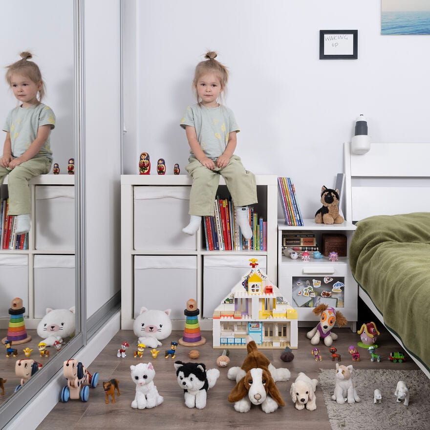 Little girl with doll and toys