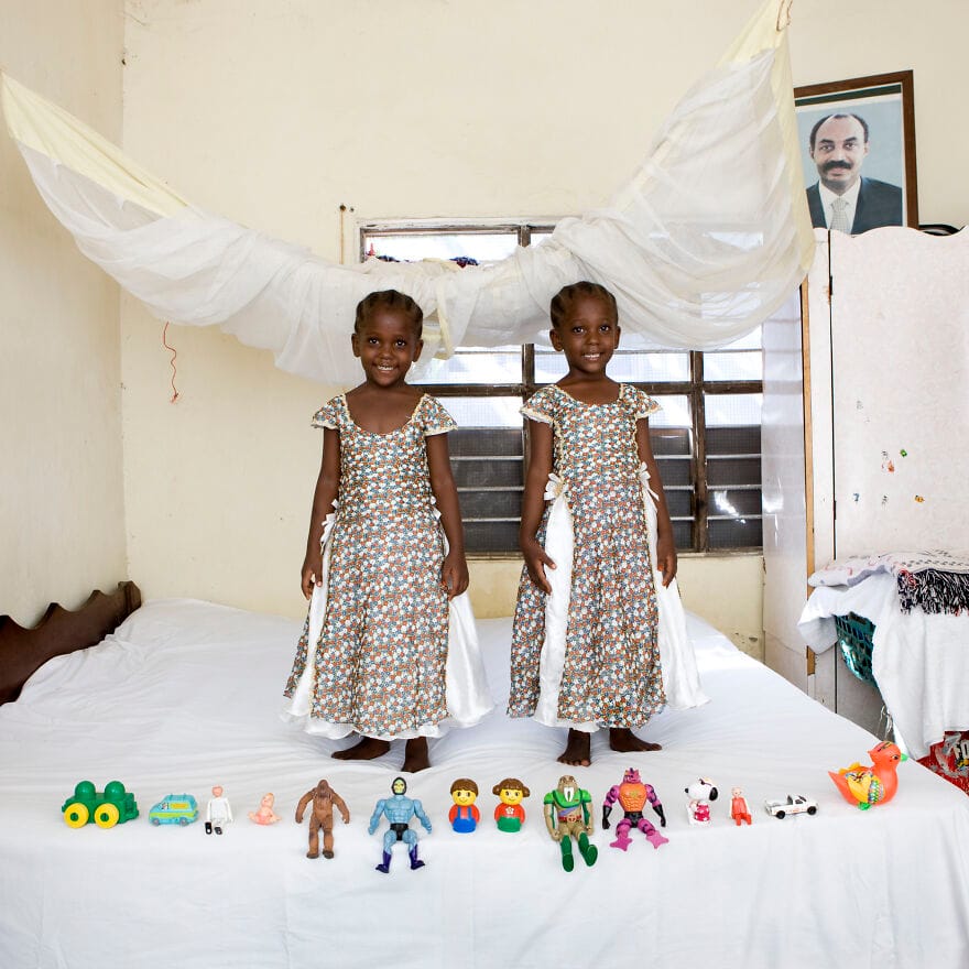 Twins with dolls and toys