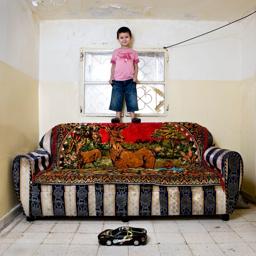 A four-year-old boy with a toy car